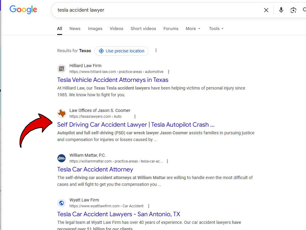 A screenshot of a Google Search engine results page for the search query tesla accident lawyer displaying localized results for Texas. A large red arrow points to the second organic listing, which is for the Law Offices of Jason S. Coomer.